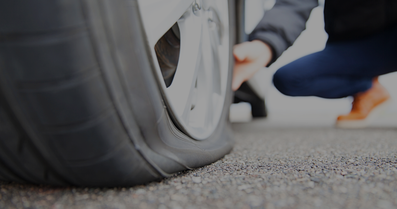 Tow Operator Changing A Flat Tire