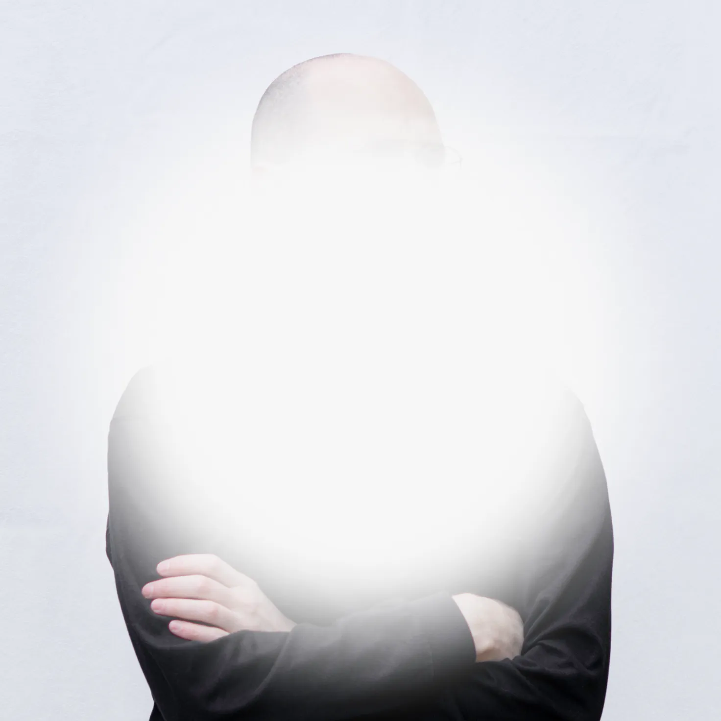 A portrait of Daniel Robert Prieto with a blurred circle in front of his face