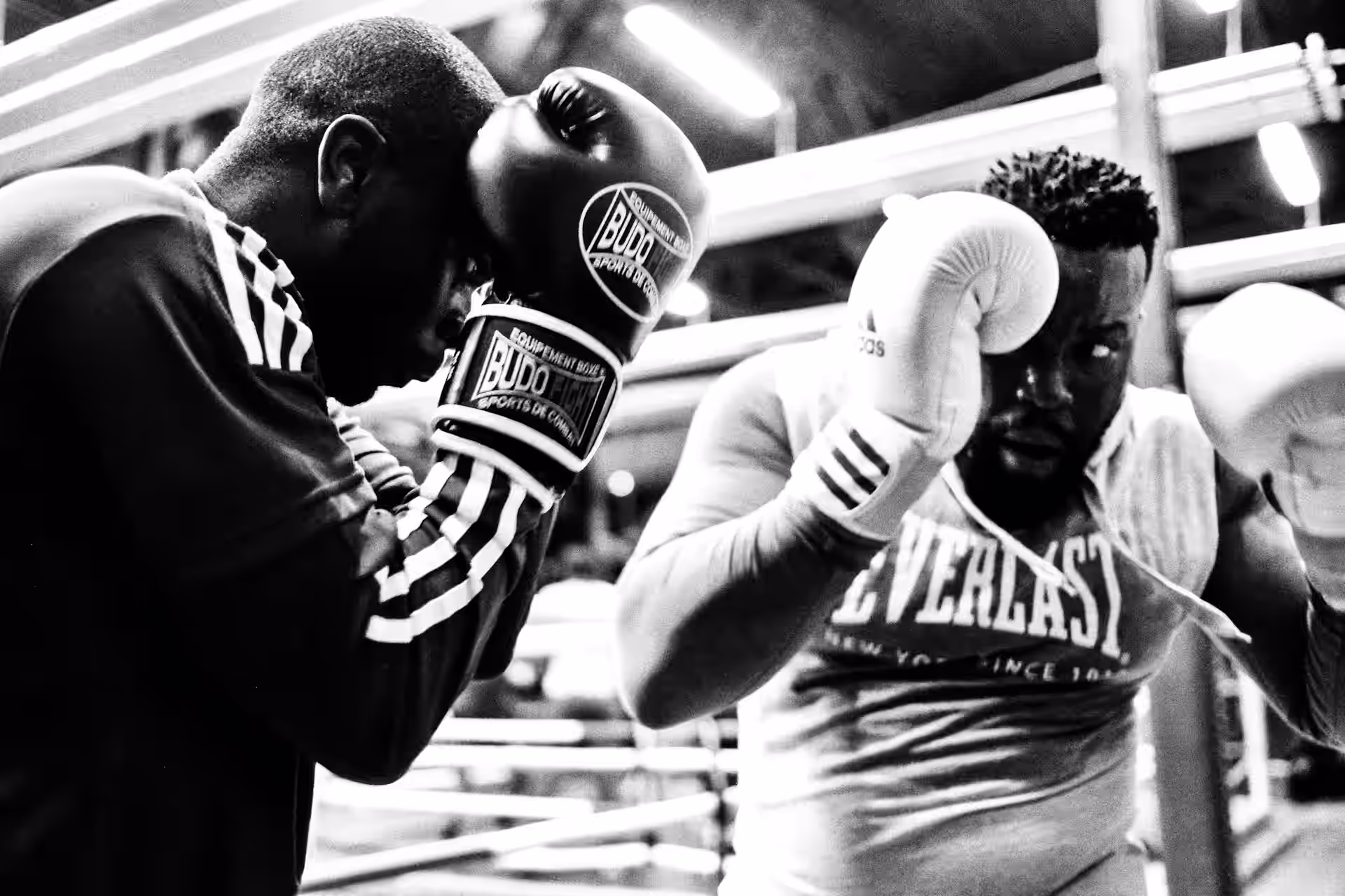 two men sparring in the boxing ring
