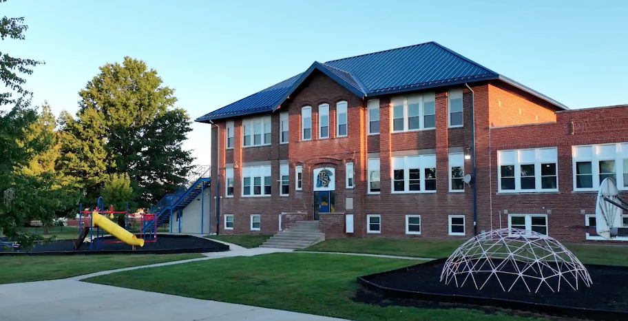 Union Star School building with its playground and dome climber.