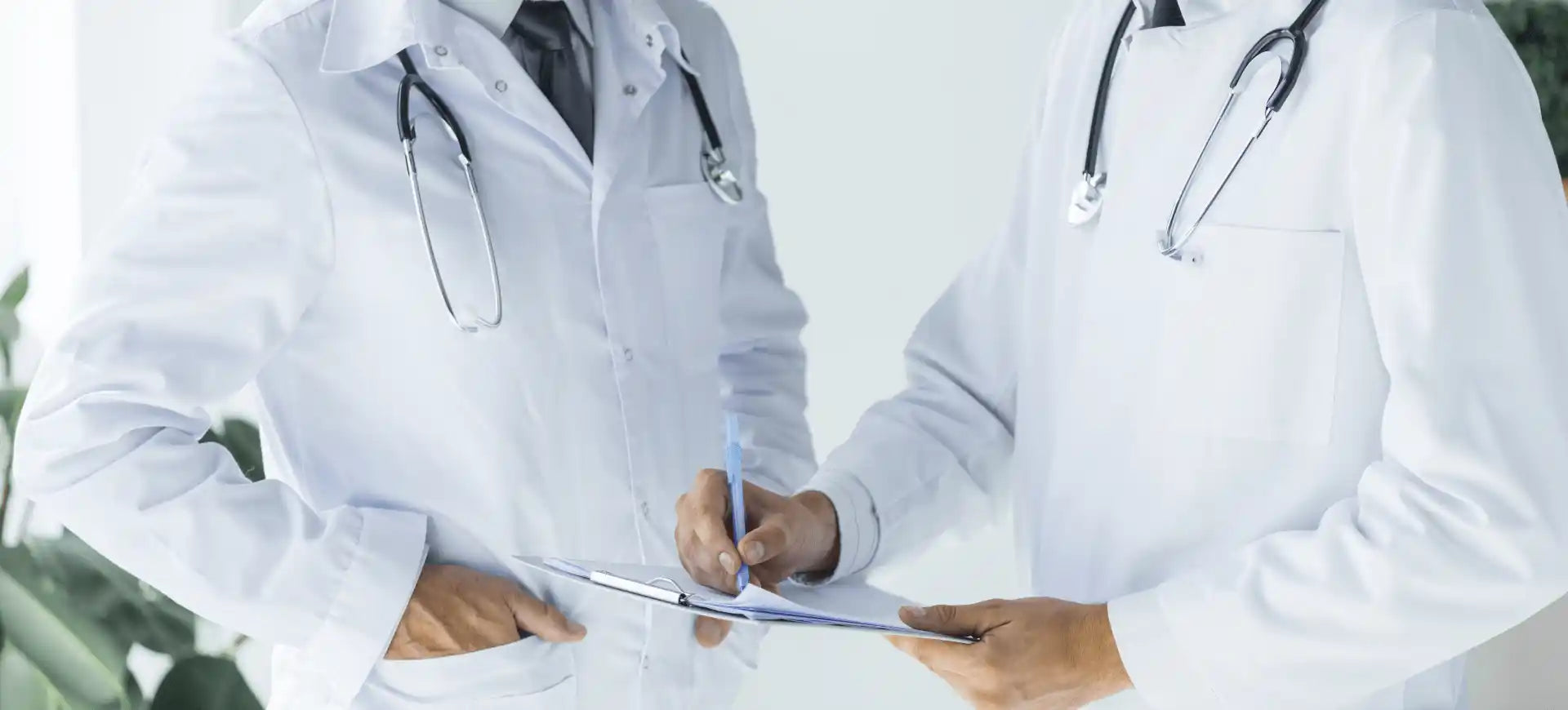 A couple of doctors standing next to each other