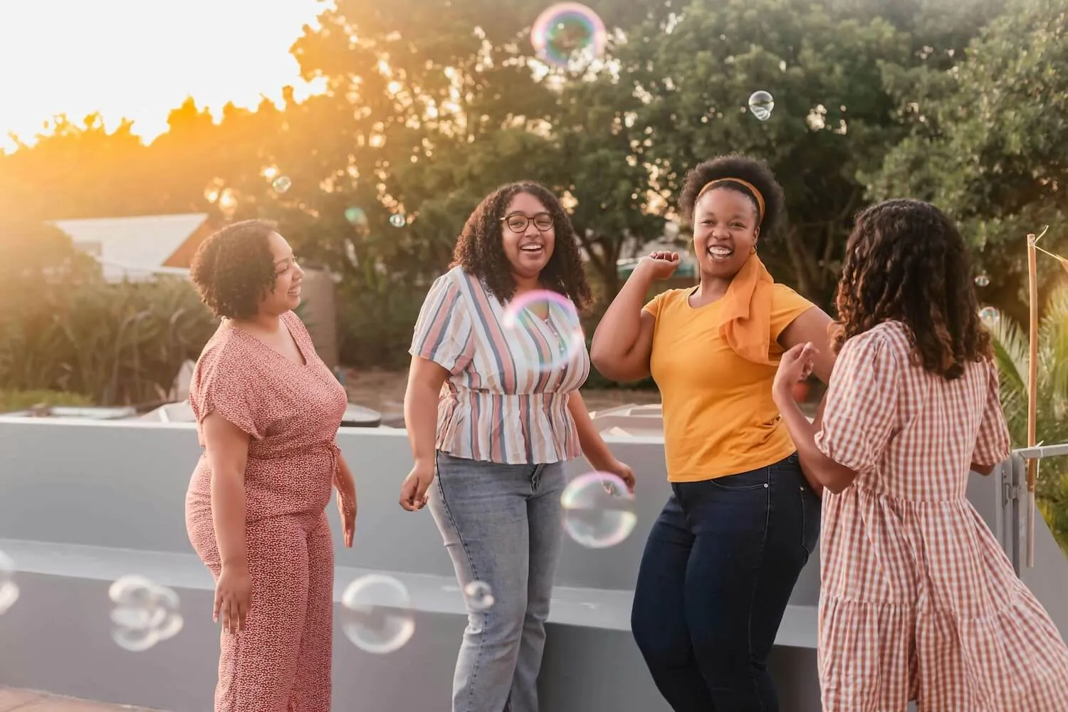group of black women laughing together