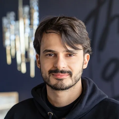 man in black and white adidas hoodie
