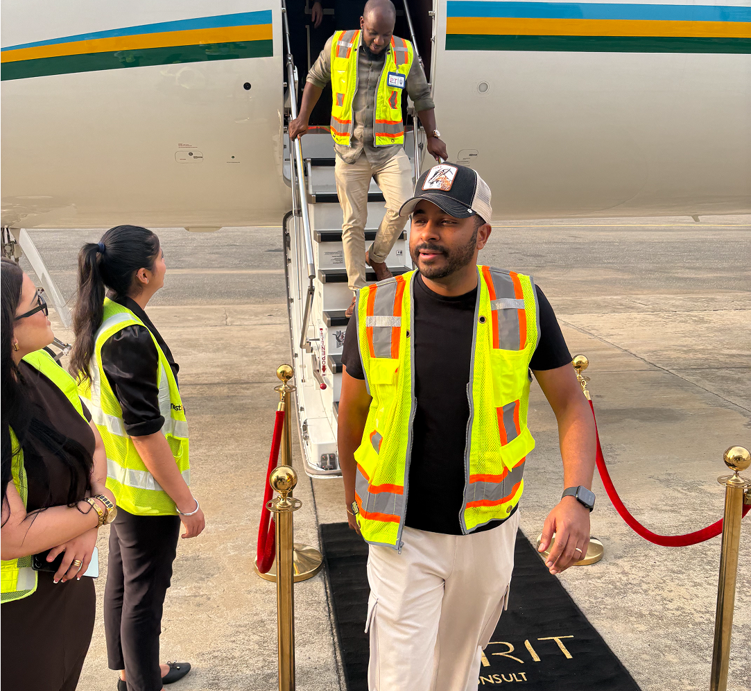 A man in a warehouse arranging cargos