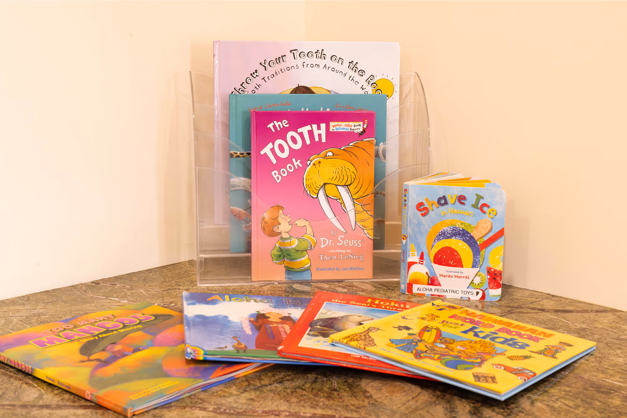A collection of children's books on a table.