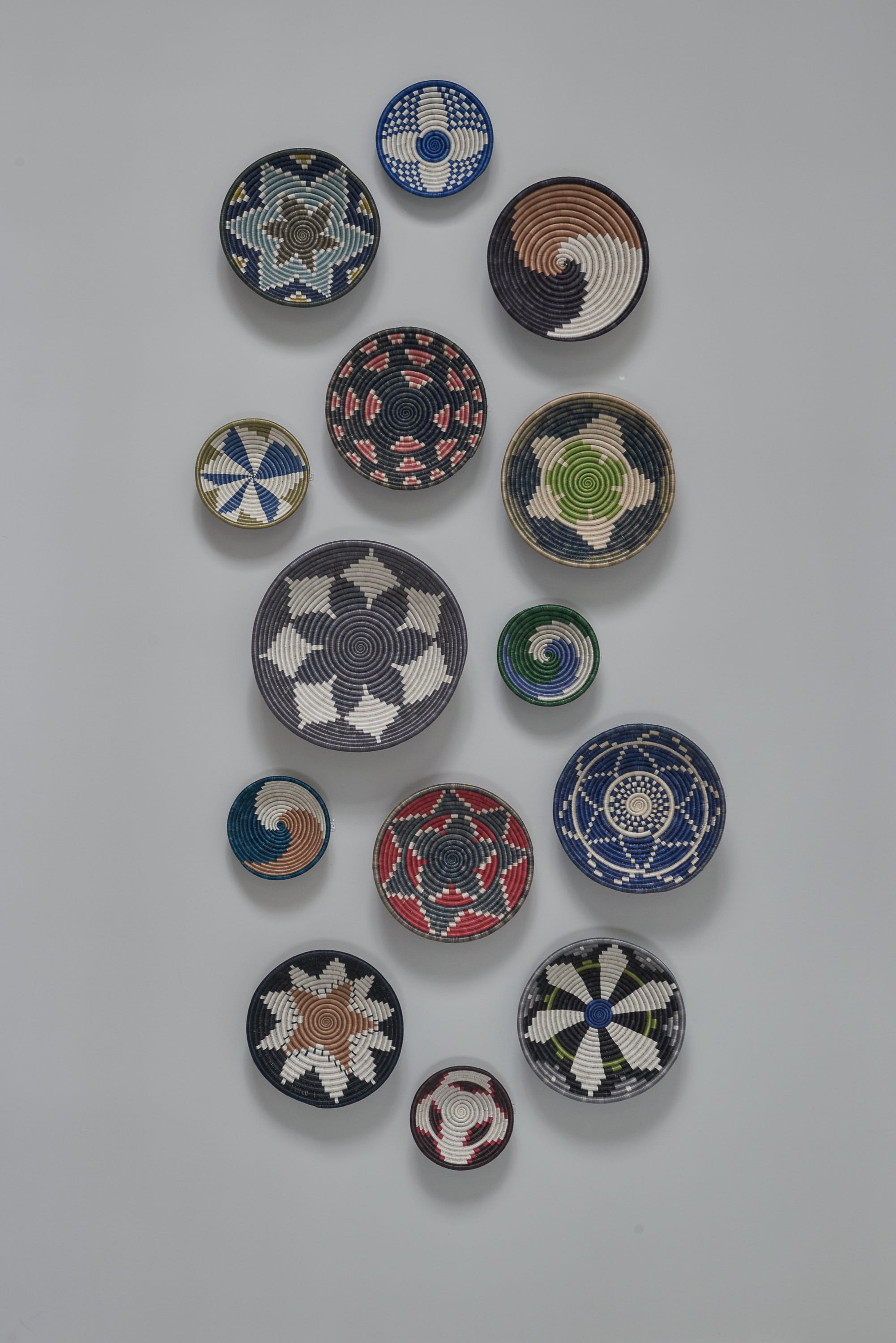 Wall display of colorful decorative plates.