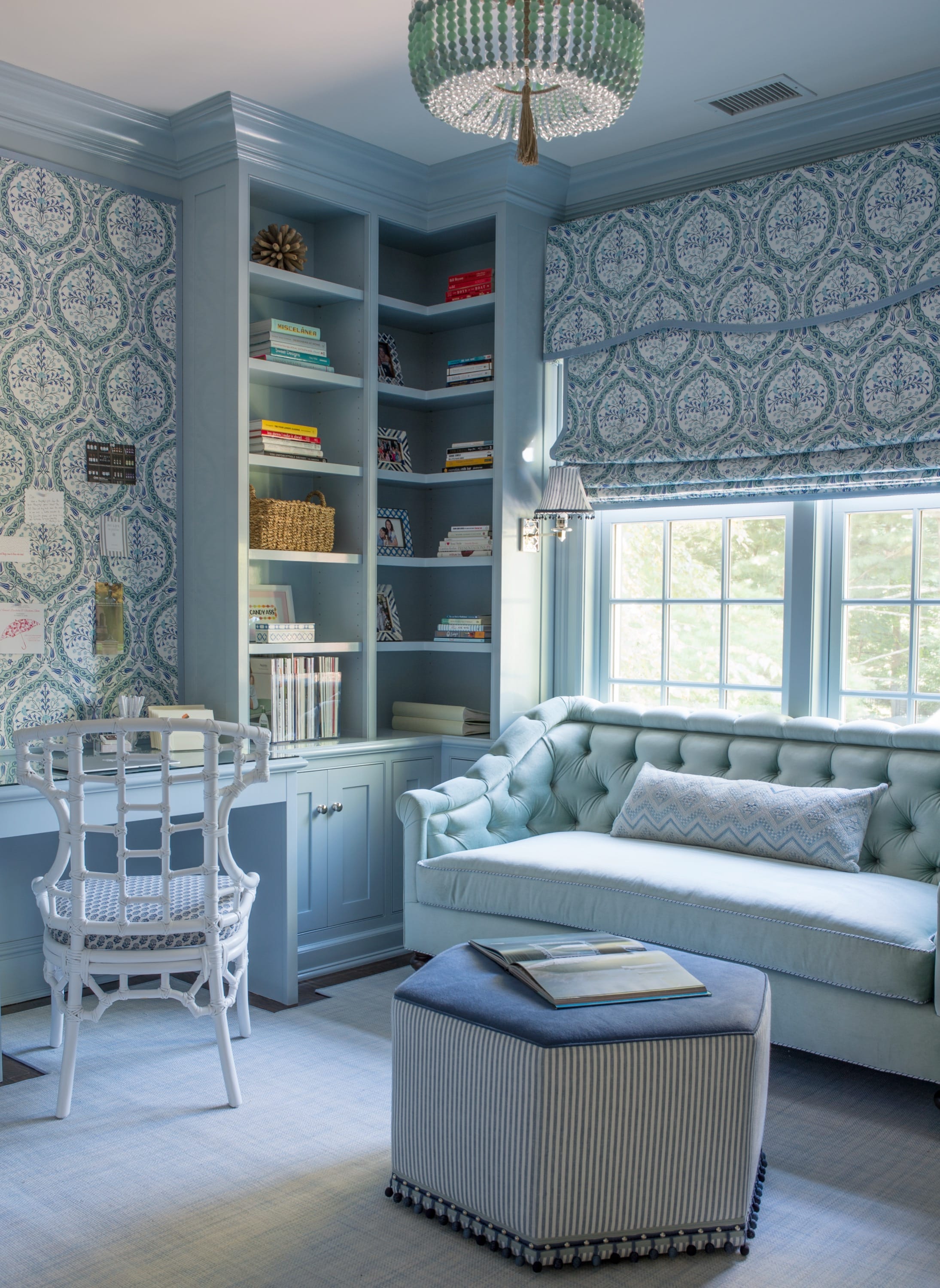 Study with patterned wallpaper and daybed.