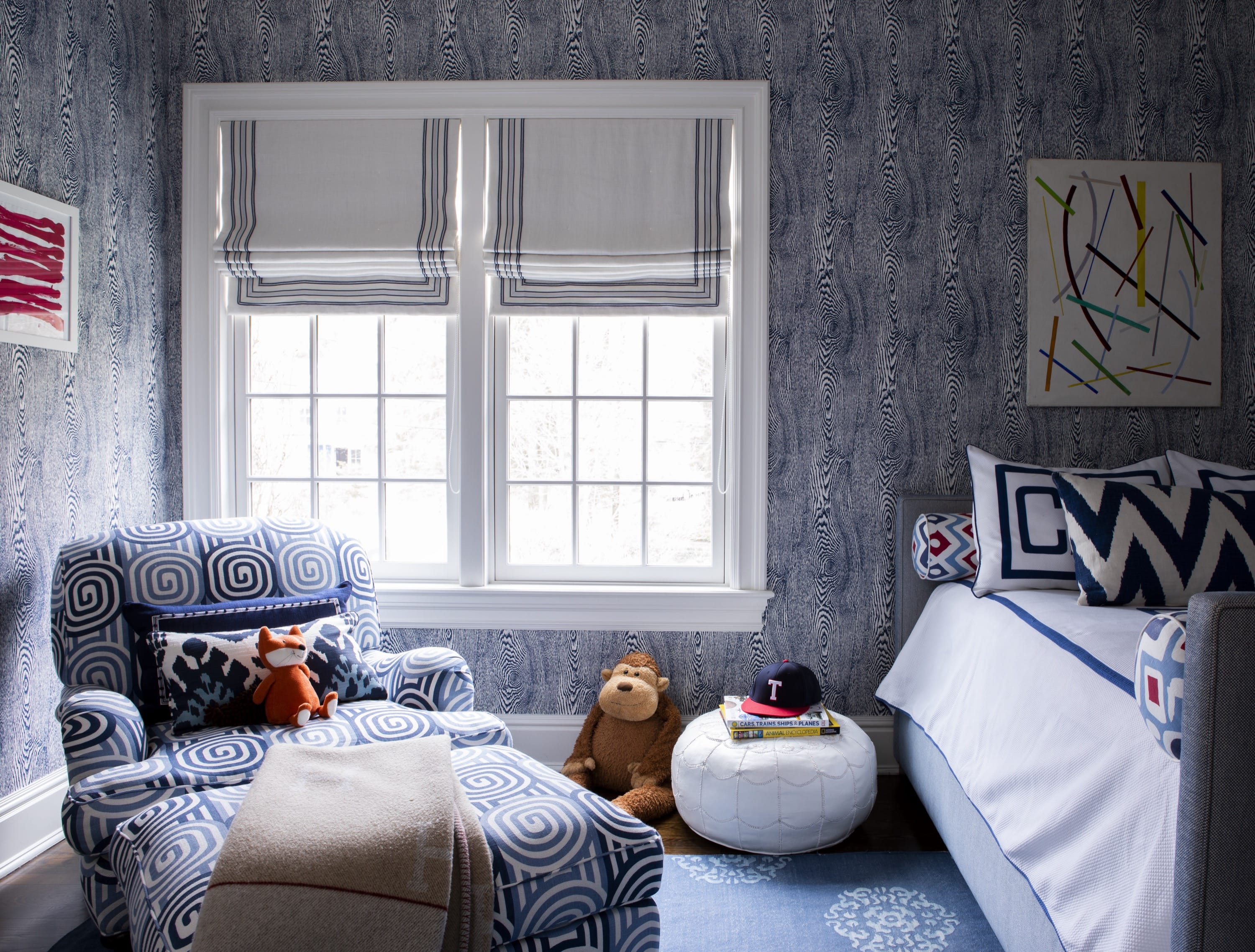 Cozy bedroom with armchair and toys.