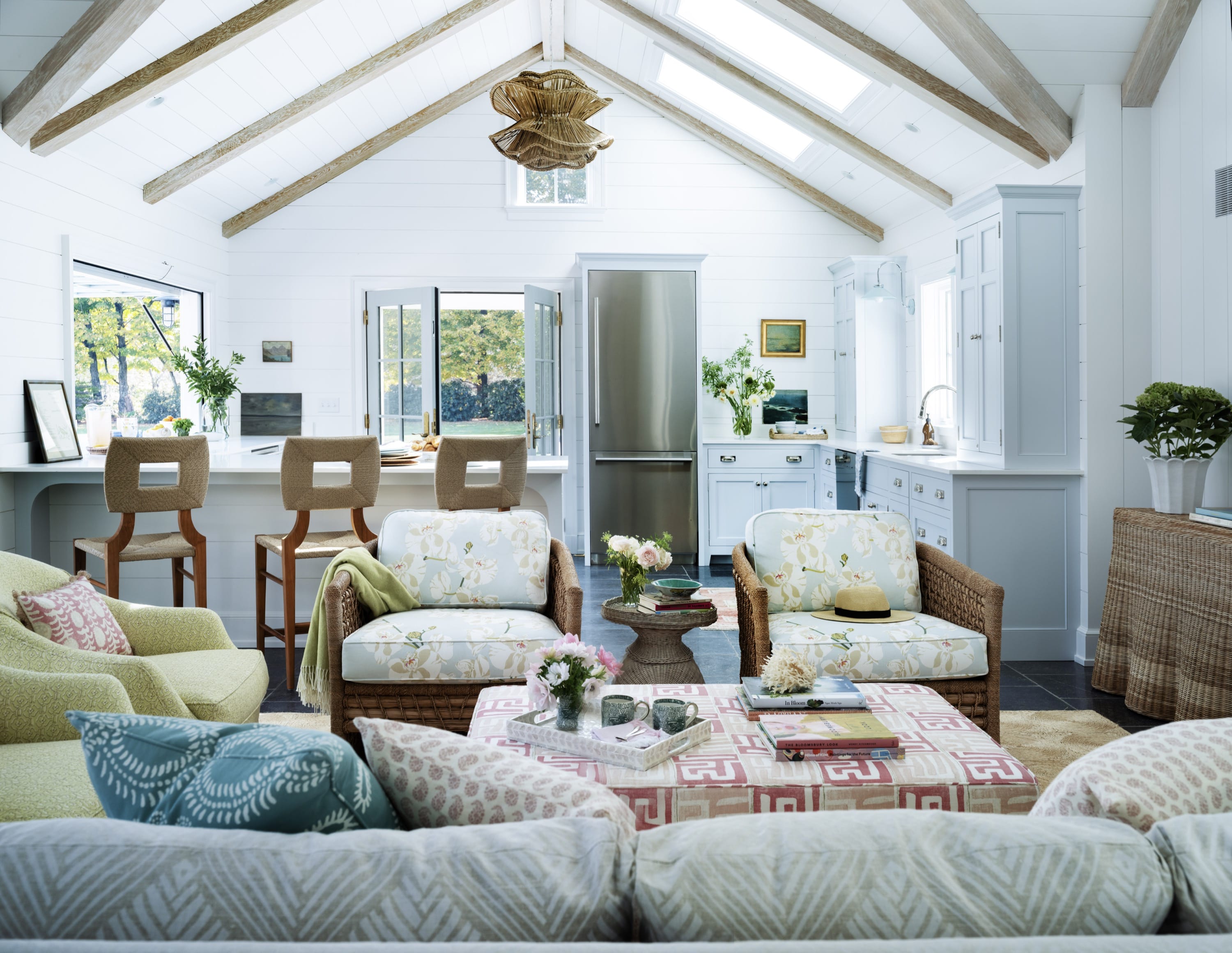 Open living room with vaulted ceiling and sofas.