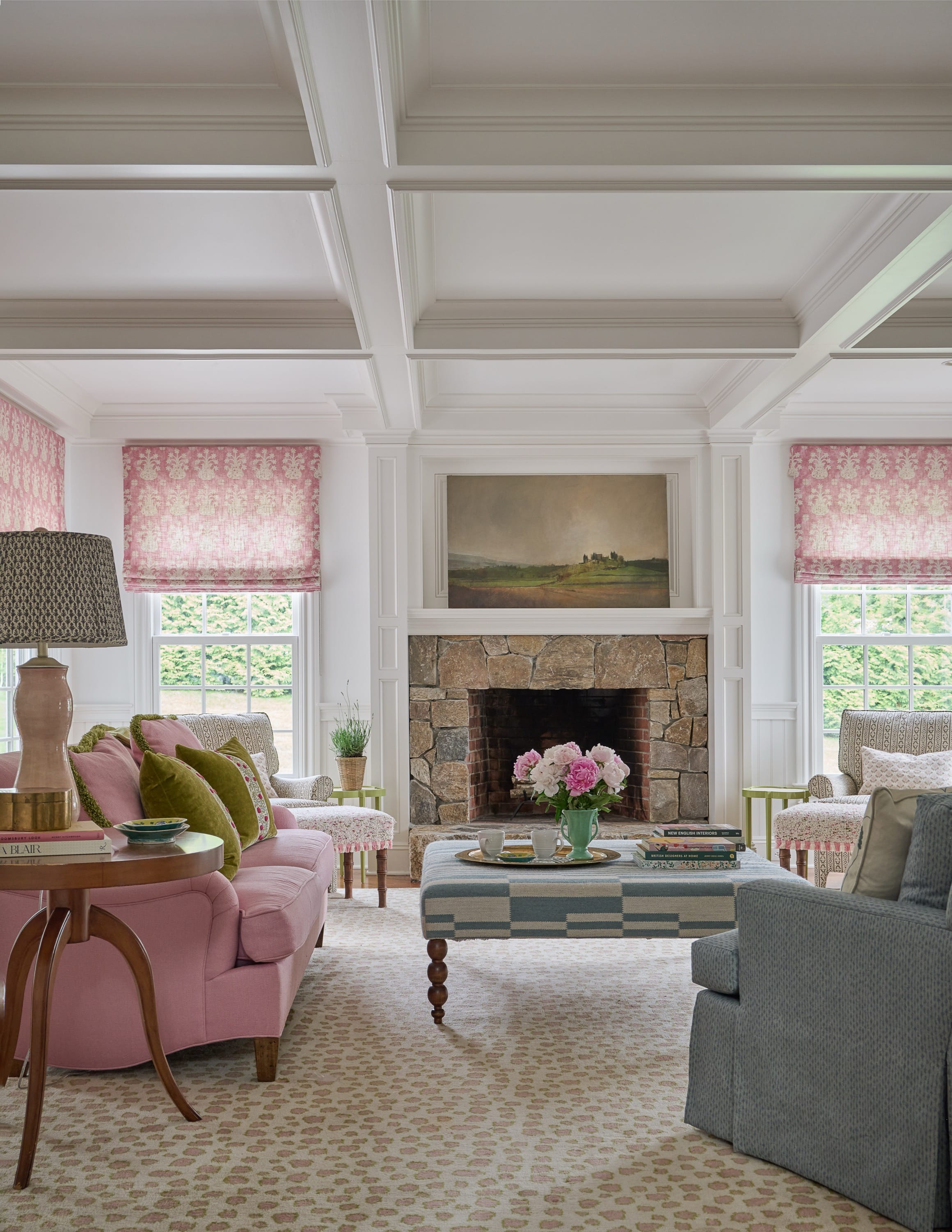 Living room with coffered ceiling and fireplace.