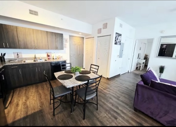 Kitchen and dining area with table and chairs