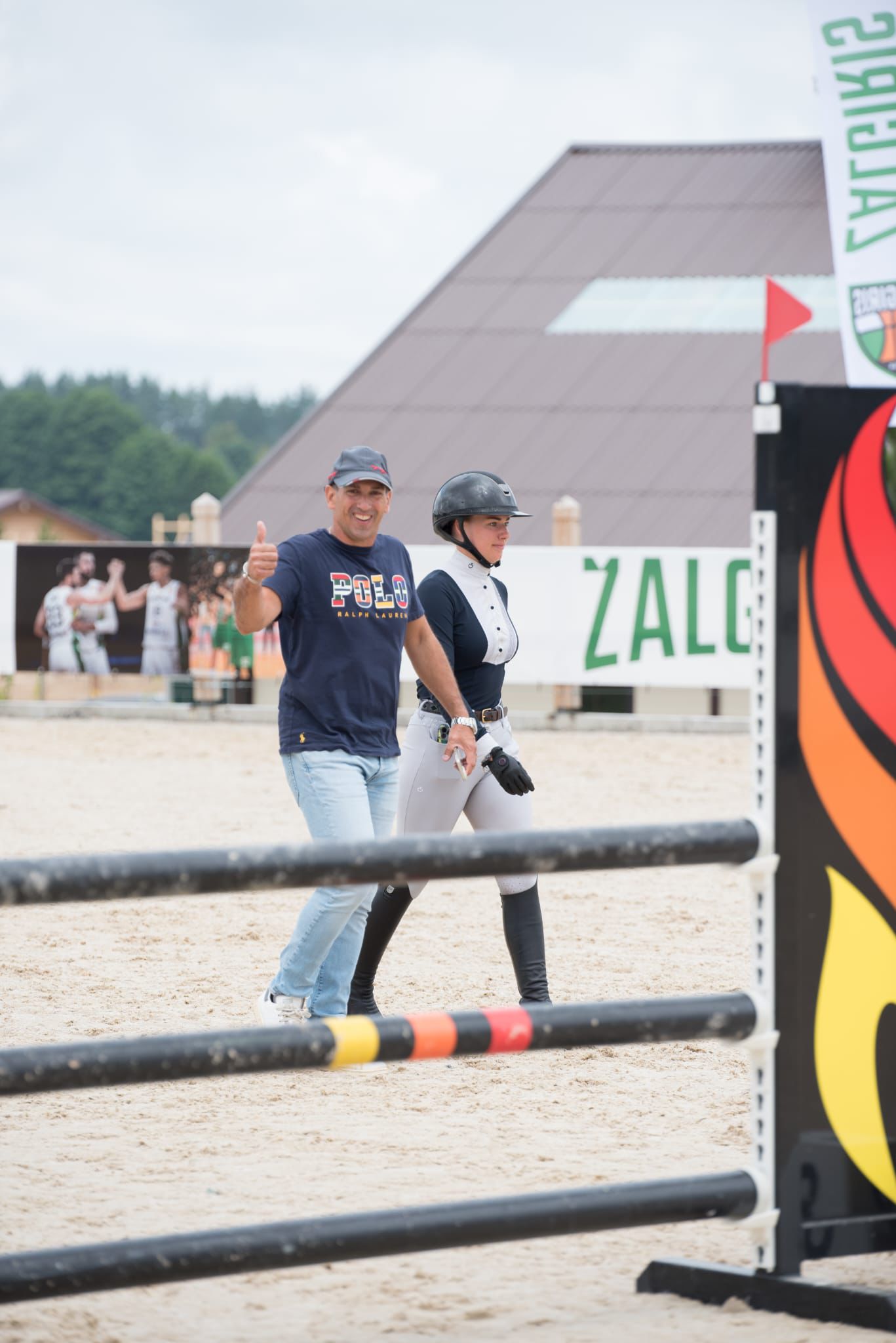 Coach and rider walking