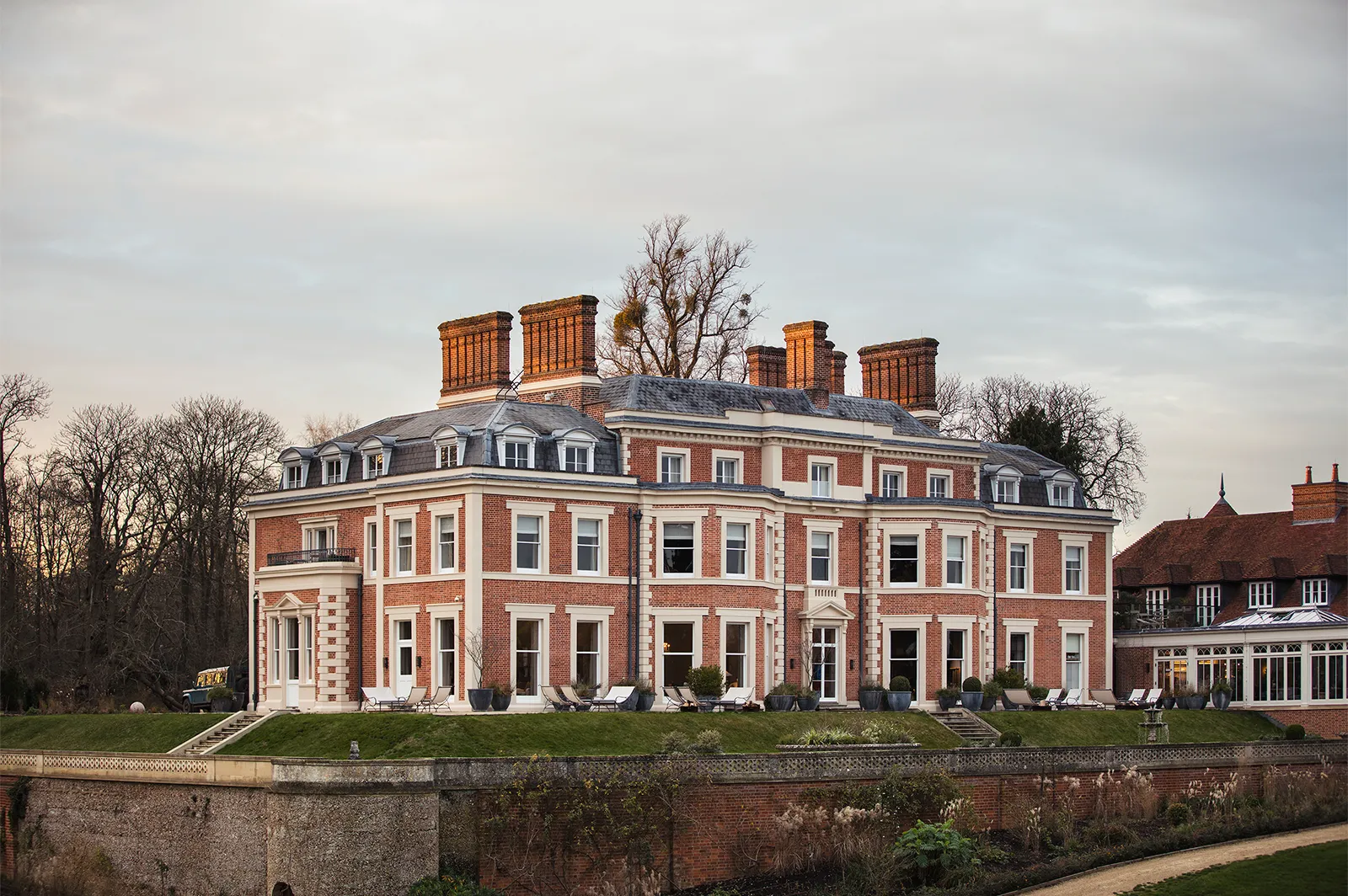 Heckfield Place, showing a landmark, historic building from a distance.