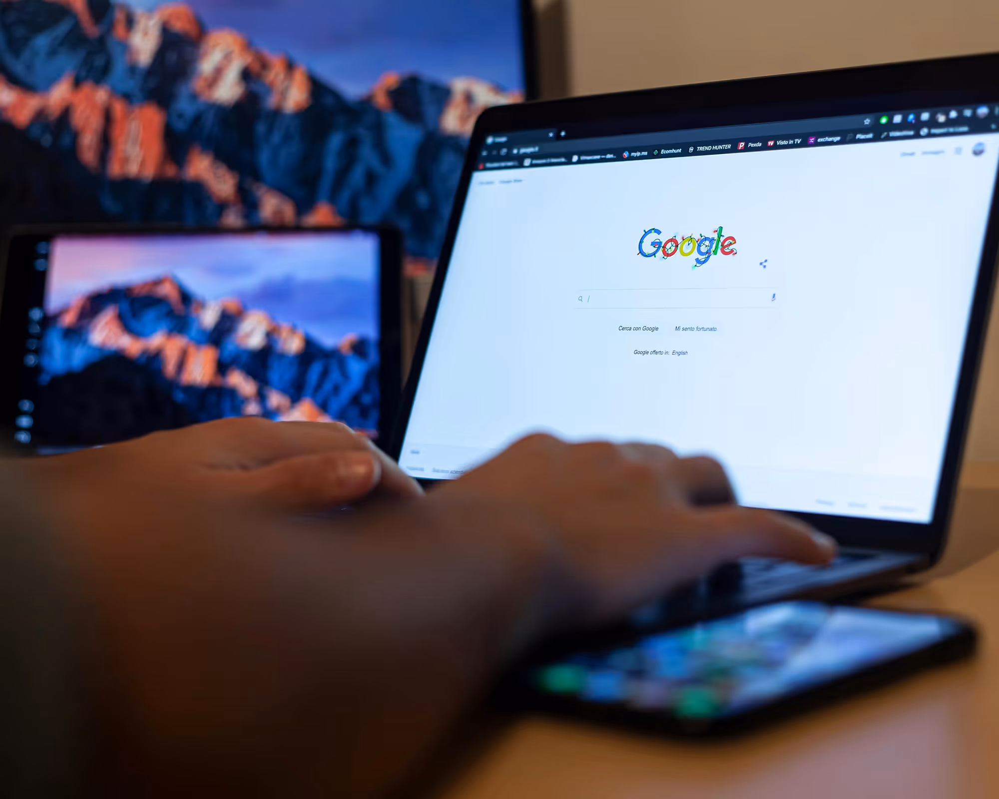 Image of a man making a google search on a computer.