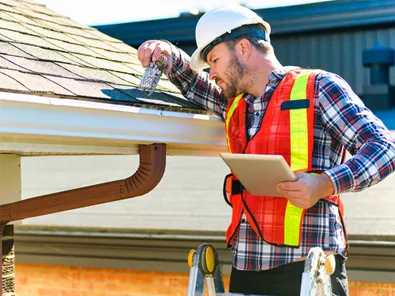 Construction engineers reviewing plans and supervising high-rise building project on-site in Florida
