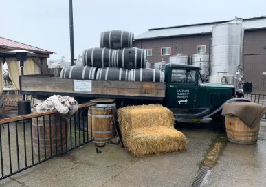 truck with haybales and barrels