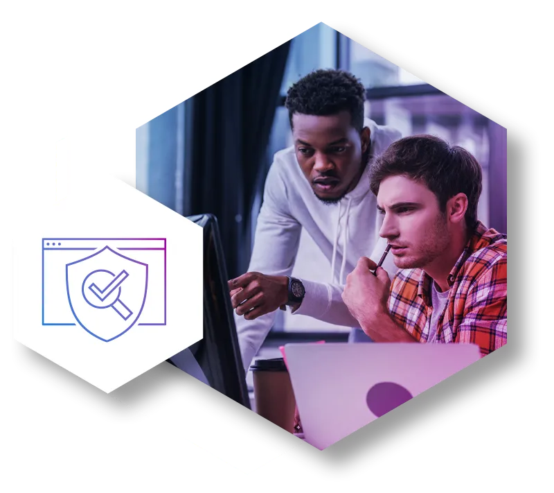 Two IT specialists intensely looking at a computer screen