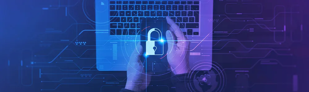 close up of laptop and mobile device being used to log in for cybersecurity