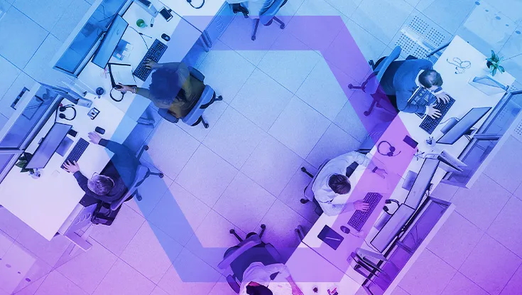 Top Down Shot of Big Busy Corporate Office with Tow Rows off Businessmen and Businesswomen Working on Desktop Computers. 