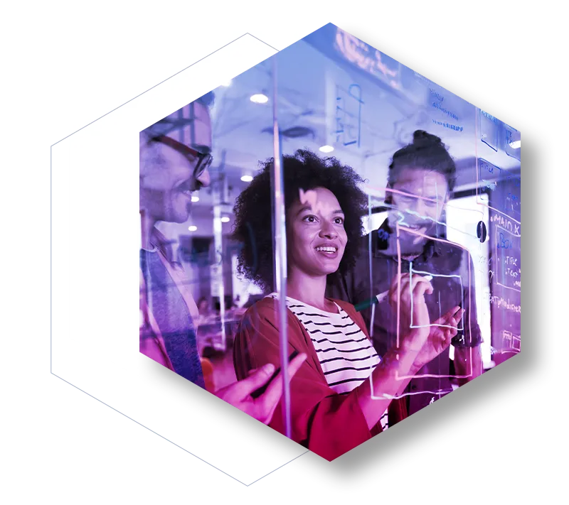 Group of Tech workers diagraming on glass 