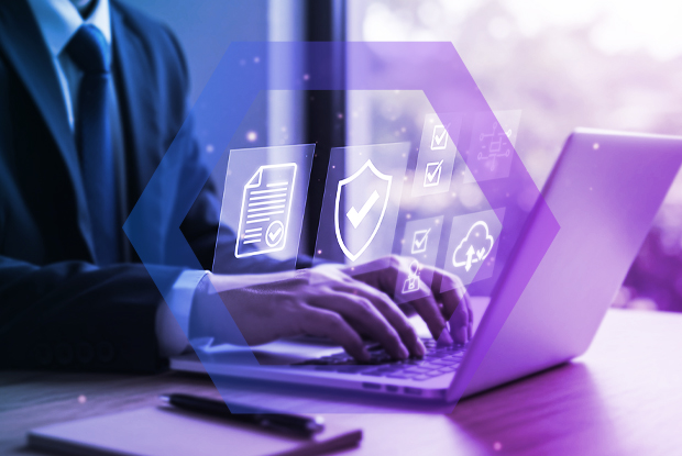  professional works on a laptop with holographic icons representing security policies, compliance, and cloud access. The image symbolizes the process of achieving a true Zero Trust architecture with a cloud-delivered enterprise browser.