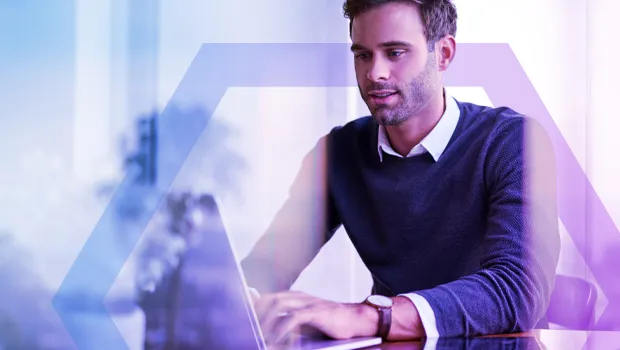 A professional man working on a laptop, representing secure access for all user types, including employees, BYOD users, and third-party contractors.