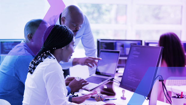 A diverse team of security analysts collaborates in a Security Operations Center (SOC), investigating an event on their computers. This image represents the rapid incident investigation and forensic visibility that Menlo Security provides to help teams make every minute count.