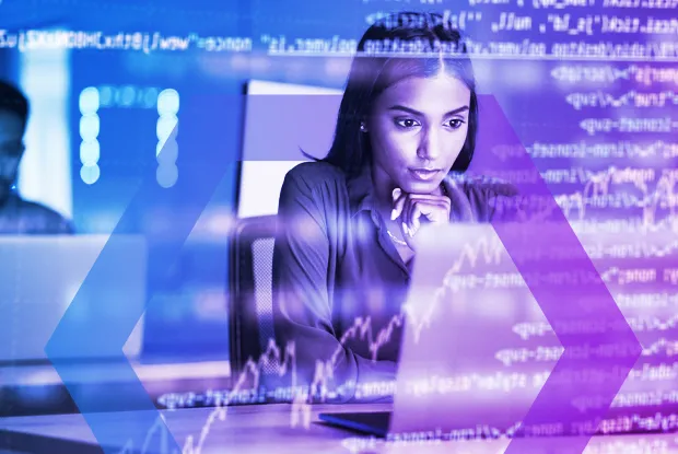 A security analyst intensely focused on her laptop, representing the deep visibility needed to view user activities in near real time. The image symbolizes how modern forensics tools eliminate guesswork and provide clear proof during incident investigations