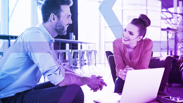 Two professionals collaborate confidently on a laptop, representing a secure work environment where weaponized documents are neutralized. The image symbolizes how Menlo's advanced file security strips malicious content and reconstructs 100% safe files, eliminating the risk of file-borne ransomware