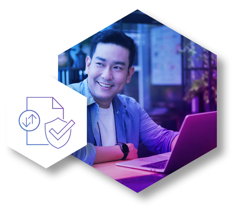 A happy employee works on a laptop, with a secure document icon in the foreground representing definitive proof of compliance. This visual illustrates how a modern security solution provides visibility and control over sensitive data and file-borne threats, eliminating the guesswork of legacy systems