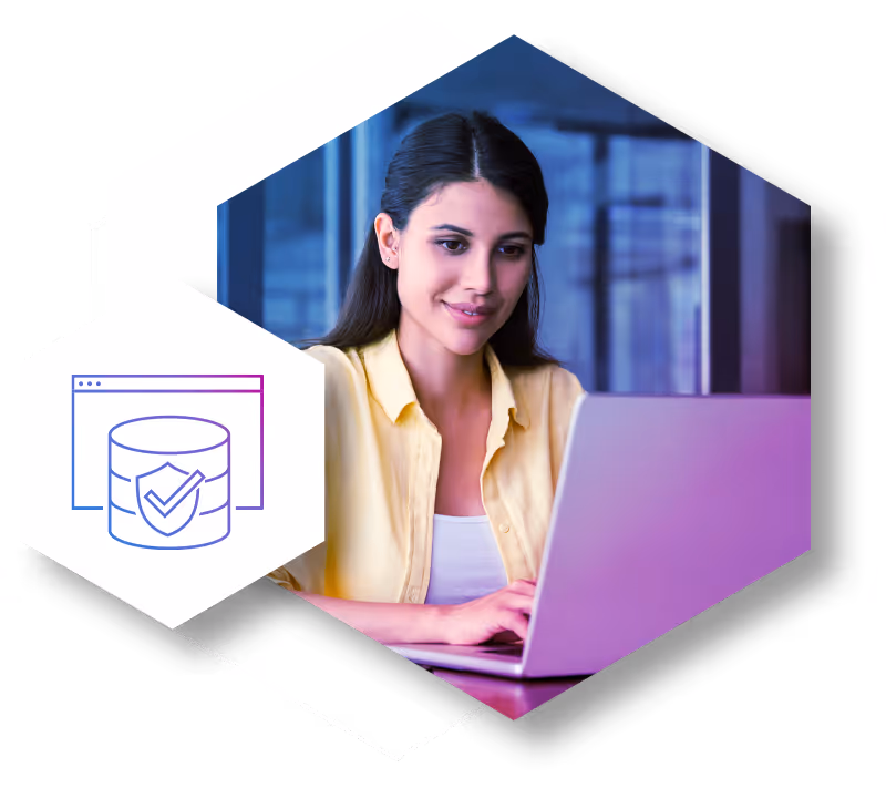 Woman in a yellow shirt working on a laptop with a data security icon showing a shield and checkmark over a database graphic.