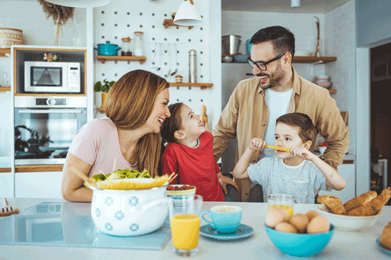 familly sitting around a table discussing personal insurance