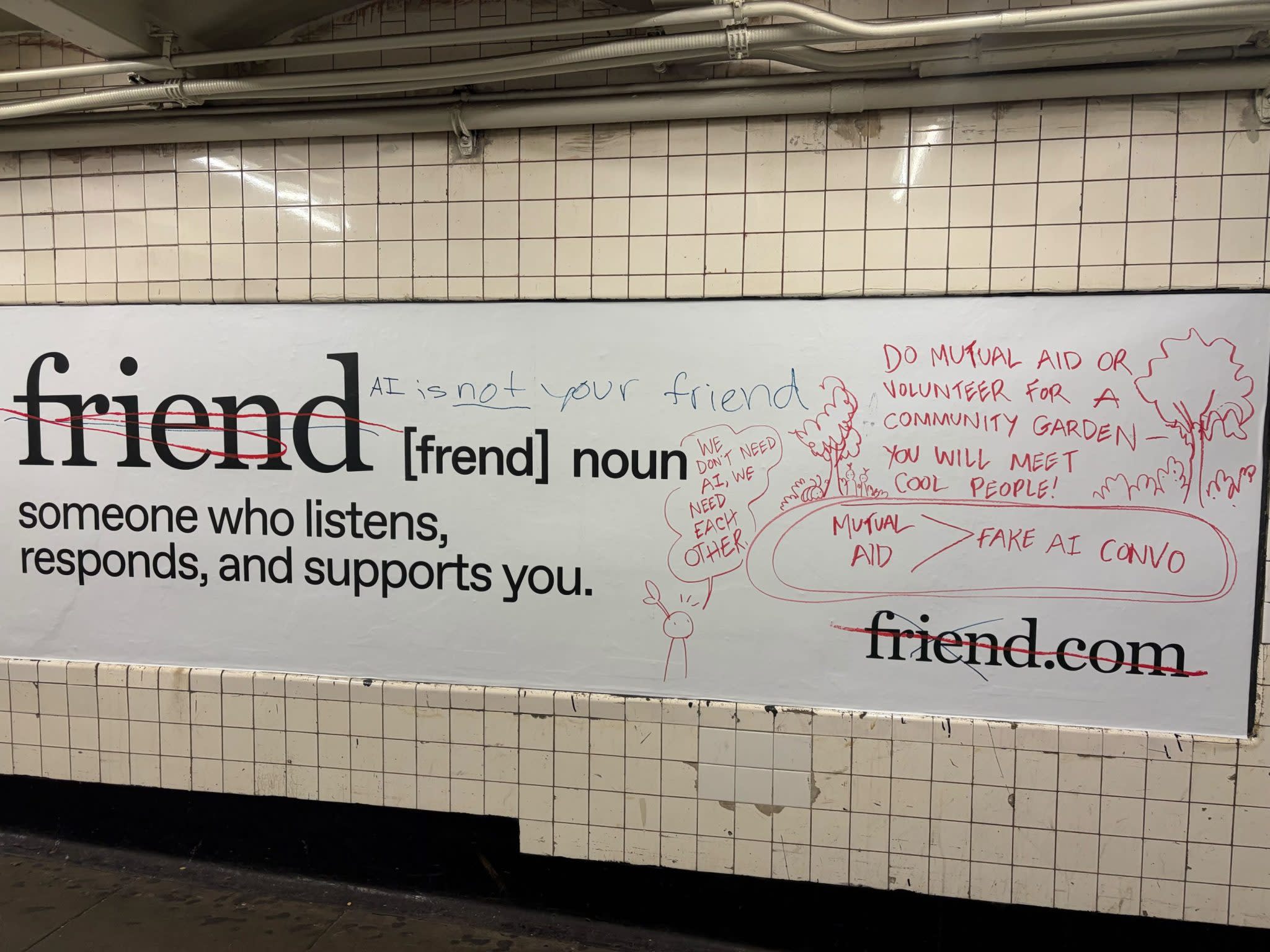 Photo of a vandalized subway ad for the AI companion Friend. The word “friend” is crossed out and replaced with graffiti that reads “AI is not your friend,” “We don’t need AI, we need each other,” and messages promoting mutual aid over AI conversations.