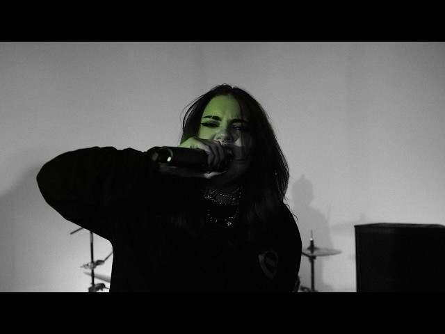 Black and white photo of a live band performing with green text overlay reading 'BLACK IVAR' and 'LIVE @BULLY'S STUDIO'.