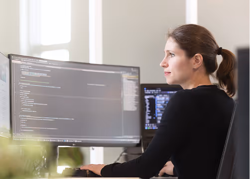 Female software engineer developing new features.