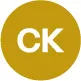 Circular icon with white letters 'CK' on a gold background.