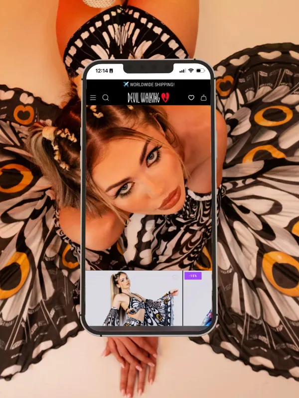 A model wearing a butterfly shaped rave suit.