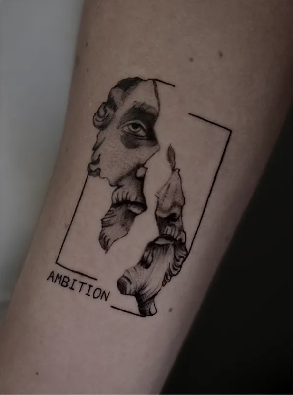 Black and grey tattoo of a realistic eye above a skull with a tree and hanging figures on the arm.