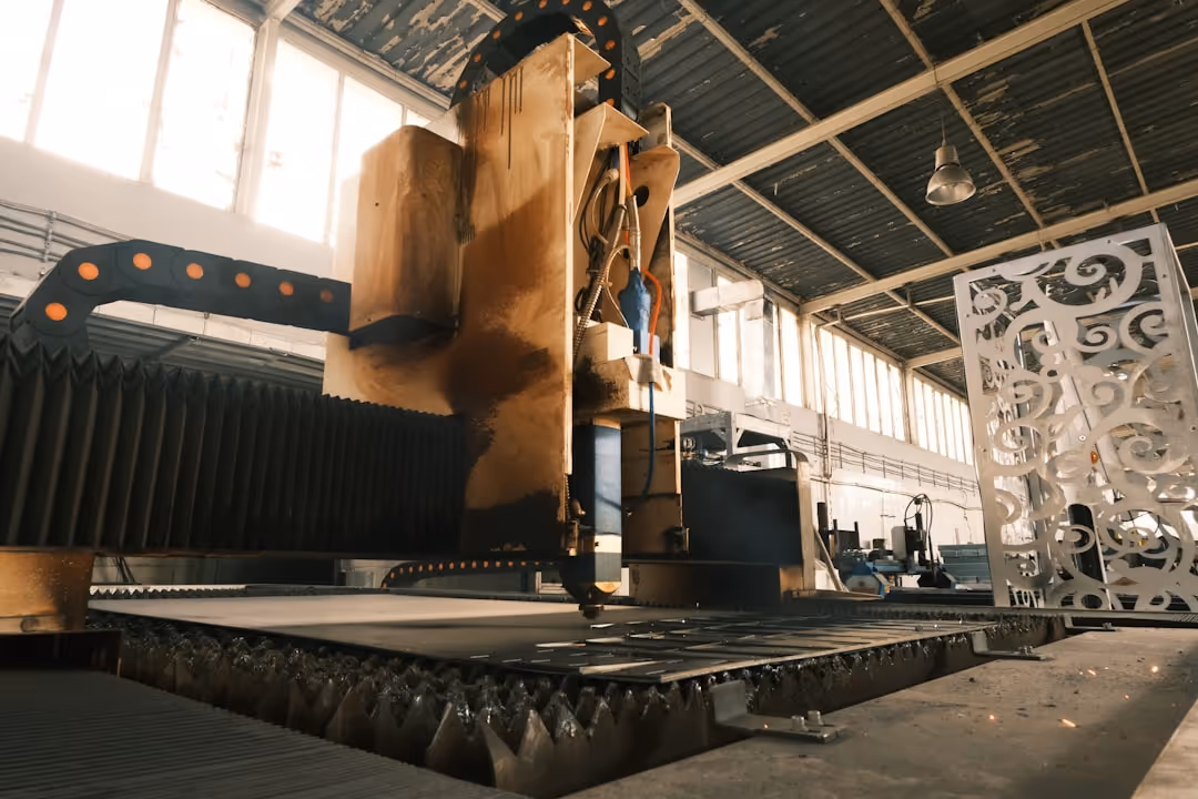 A machine that makes metal parts in a factory.