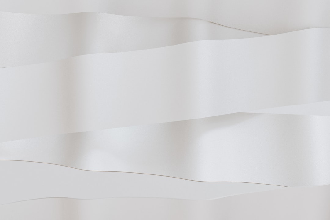 Abstract white folds create a minimalist design.