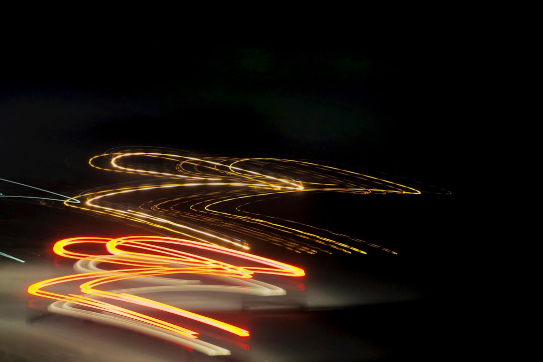 a blurry photo of a street at night