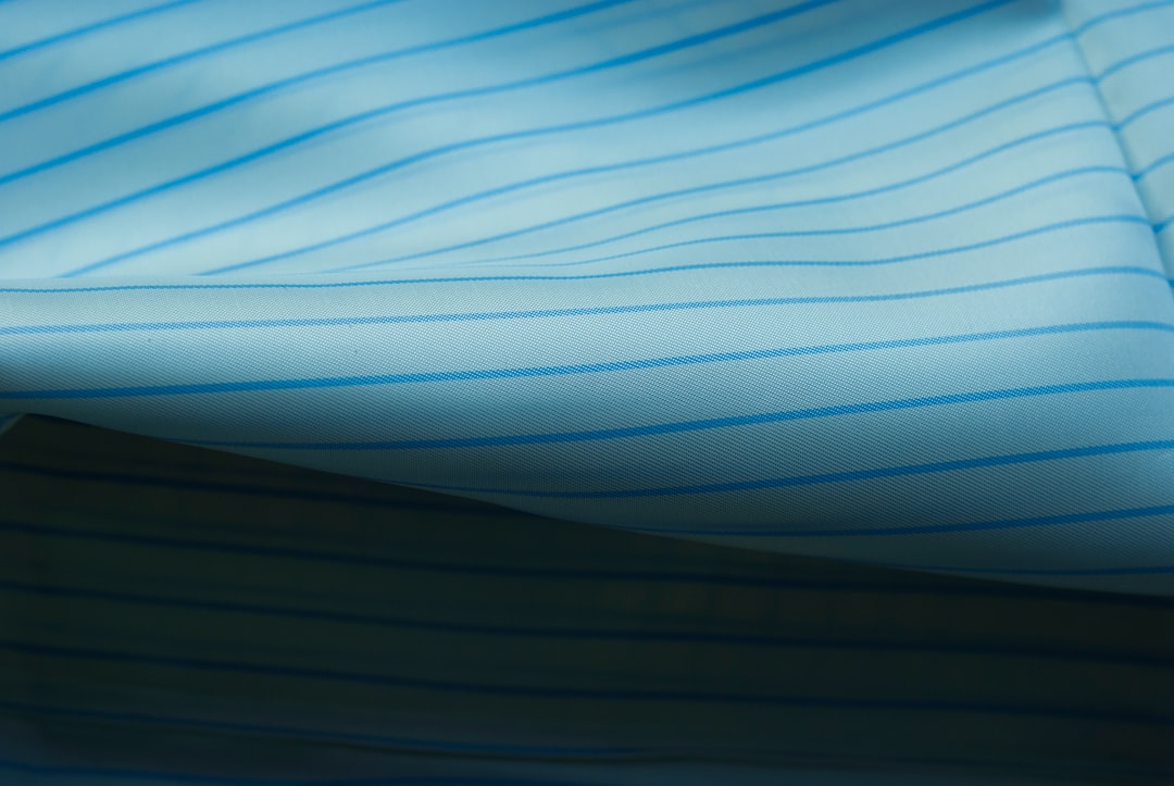 Blue striped fabric is folded over itself.