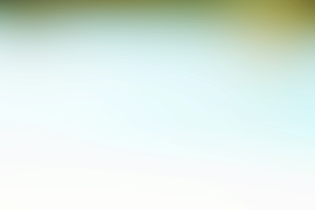 a blurry image of a green and yellow background