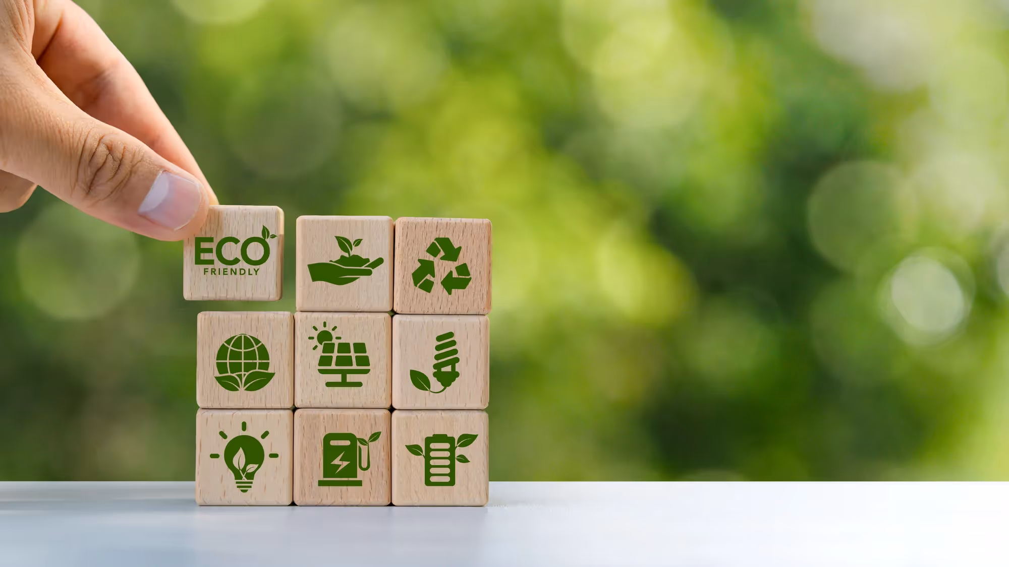 A stack of wooden blocks with green symbols on them.