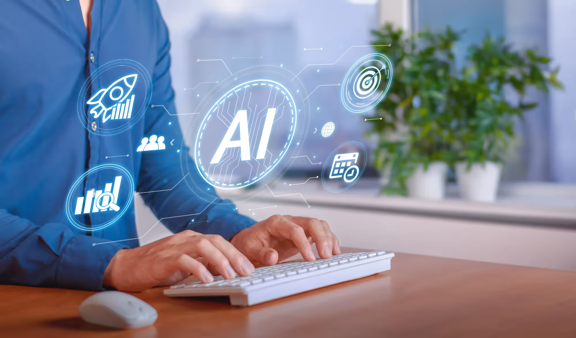 A man is typing on a keyboard with a 1 AI logo on the screen.