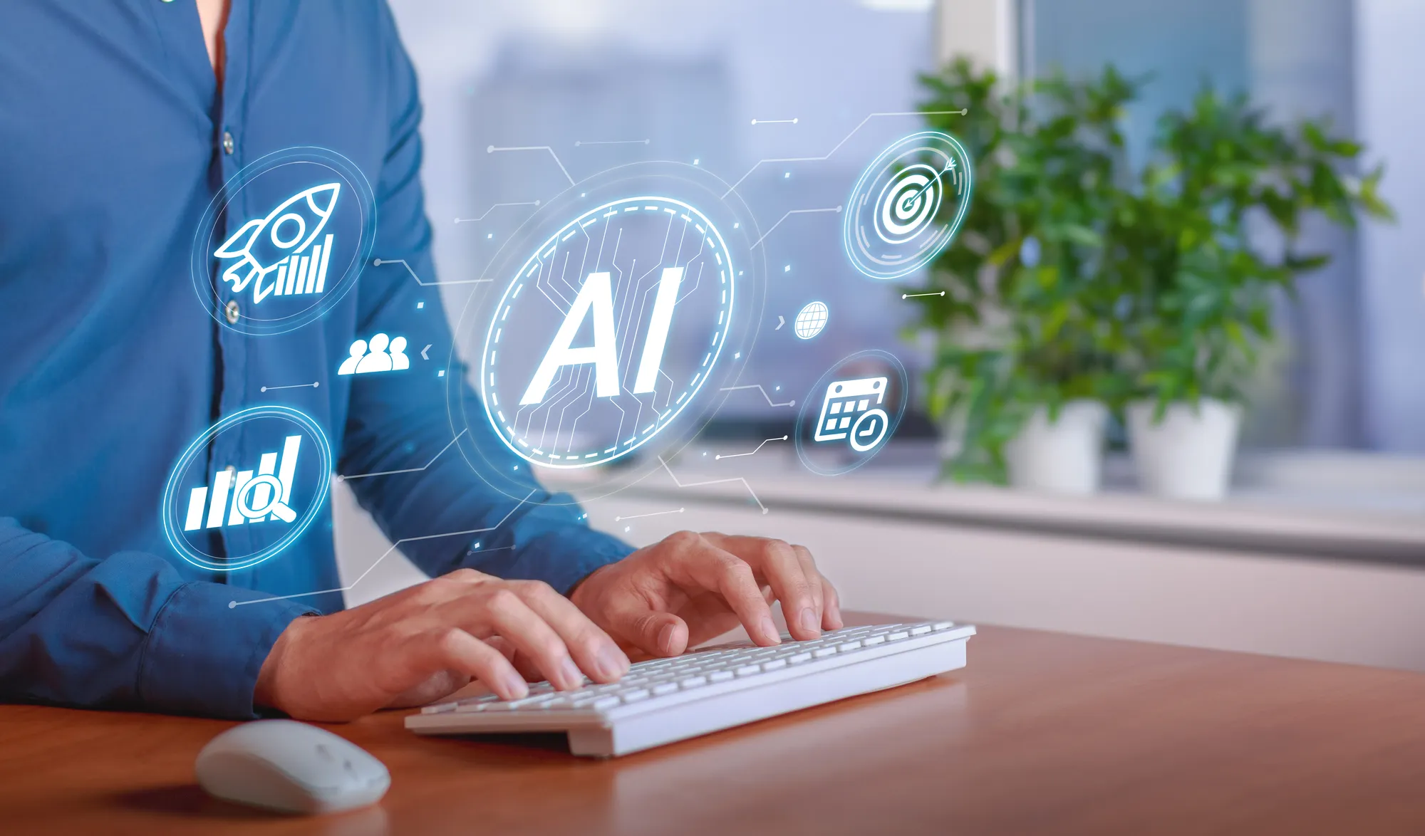 A man is typing on a keyboard with a 1 AI logo on the screen.