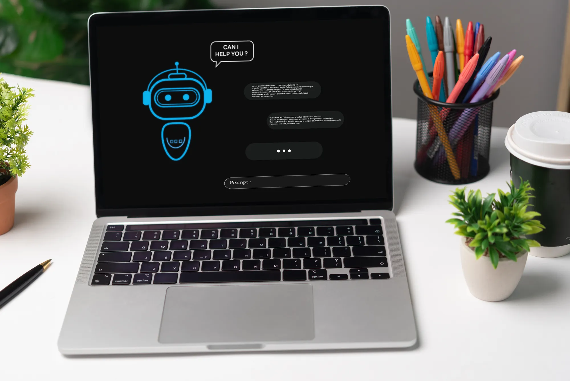 A laptop with a robot on the screen.