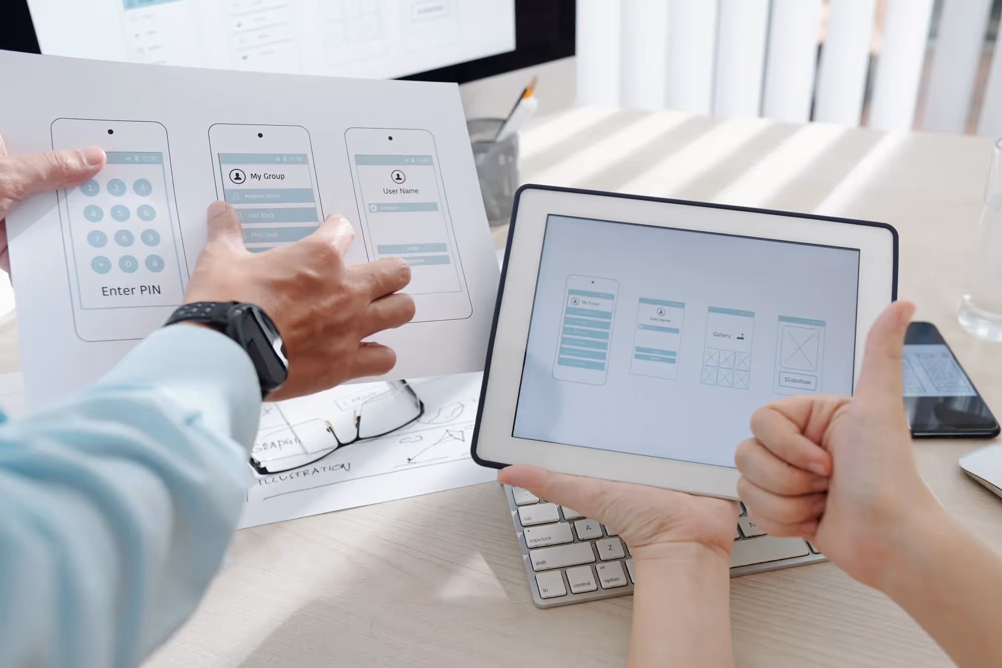 A person holding a tablet with a screen displaying a diagram.