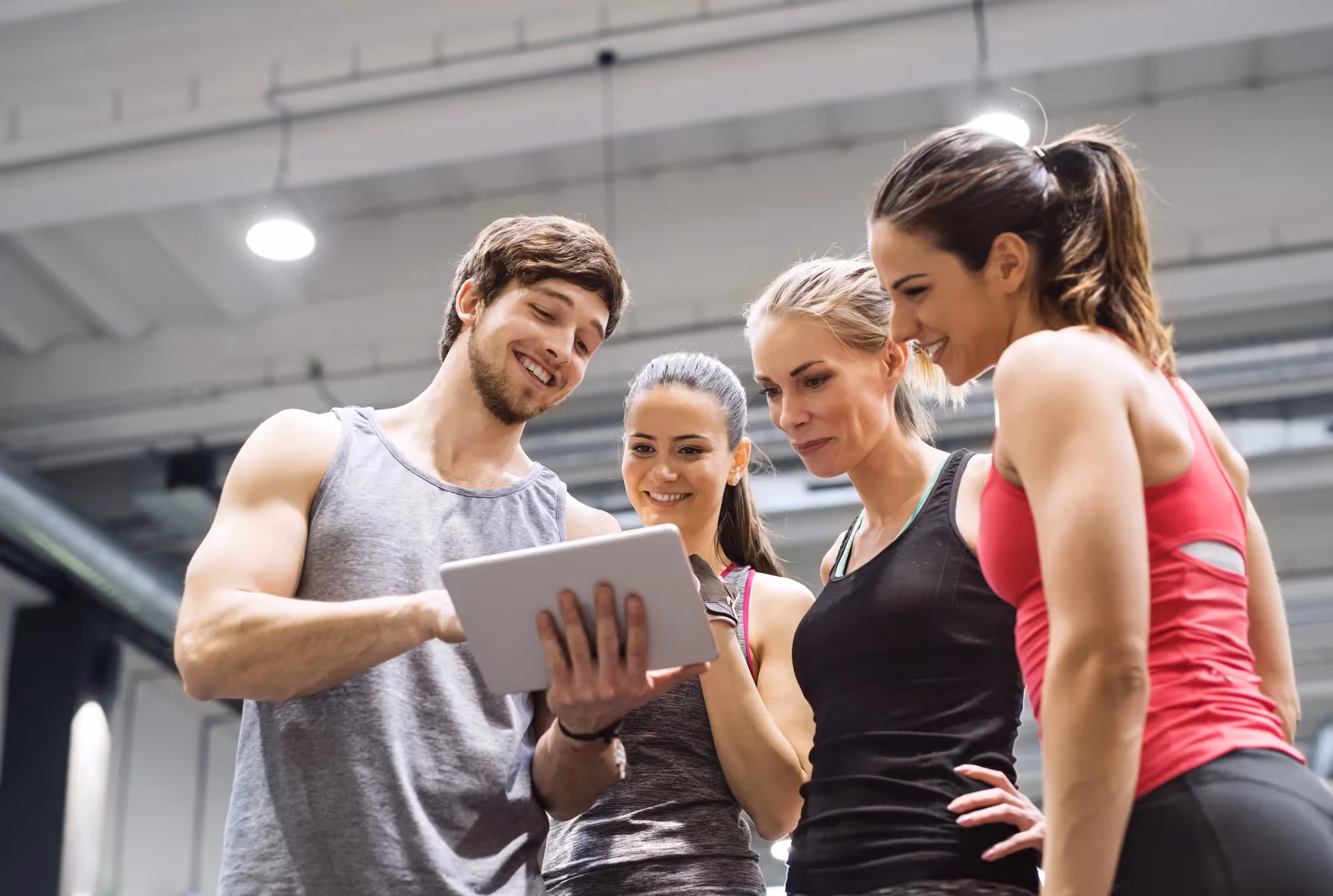 A group of people looking at a tablet computer.