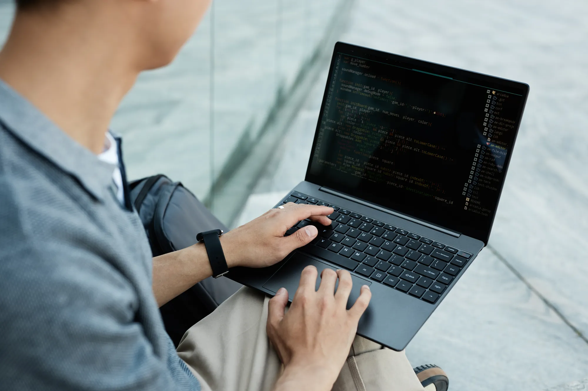 A man is using a laptop computer.
